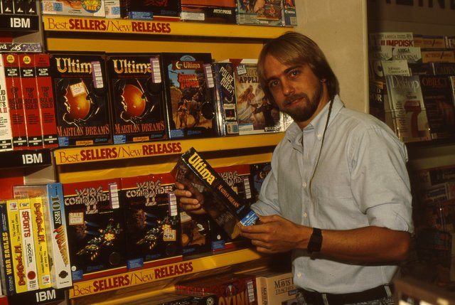Richard Garriott in 1991 with a copy of Worlds of Ultima